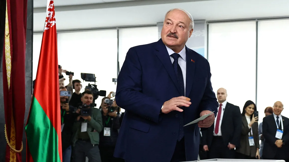 Belarusian President Alexander Lukashenko casts his ballot at a polling station