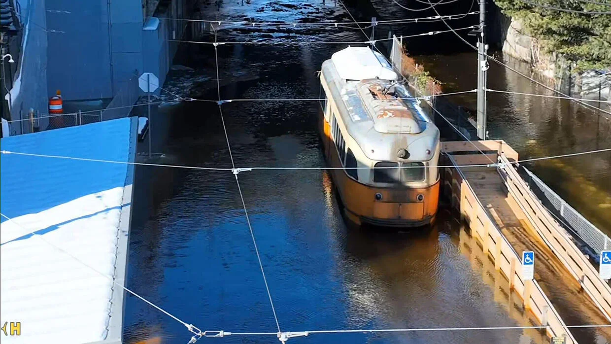Passengers rescued by raft after train gets stuck in frigid flood