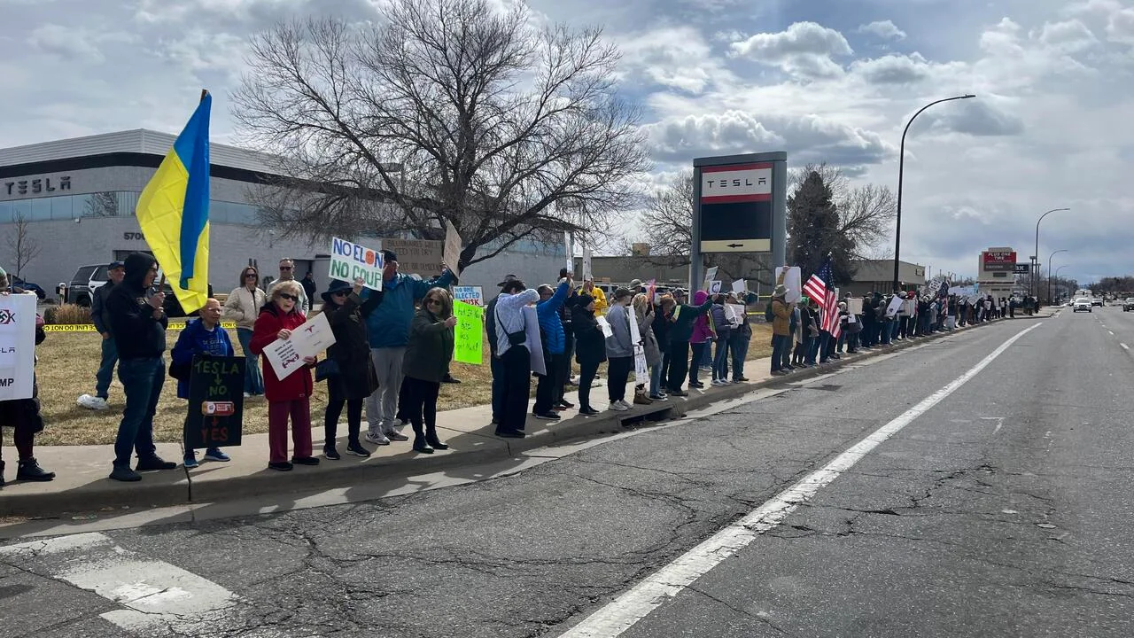 Protesters gather at Tesla dealerships across Colorado