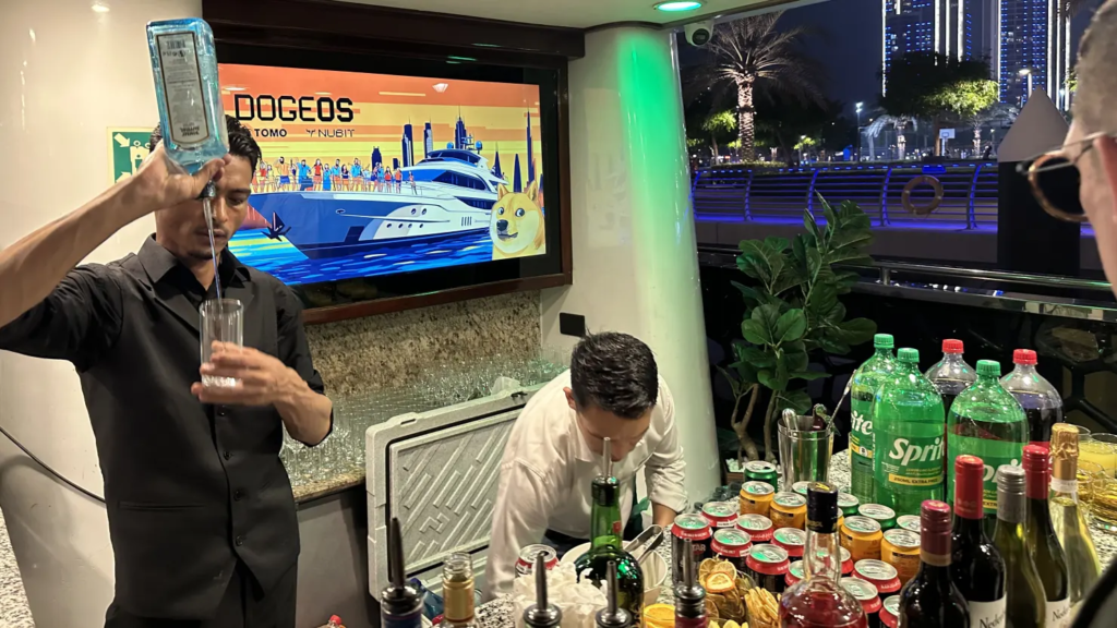 Bartenders serve guests aboard the 220-foot long Lotus megayacht in the Dubai Marina, May 1, 2025. Source: CNBC