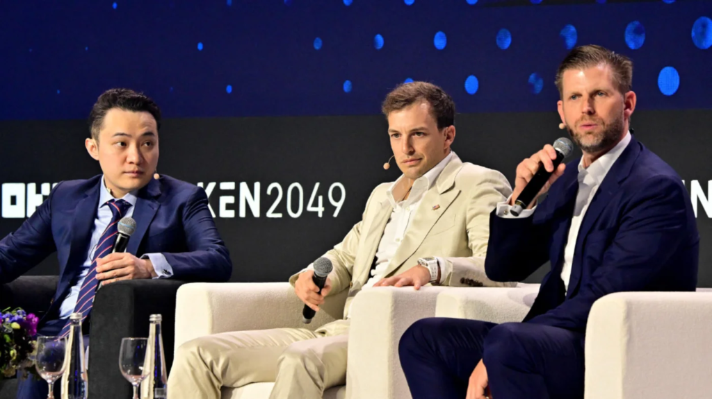 Trump Organization executive vice-president Eric Trump (R), World Liberty Financial co-founder Zach Witkoff (C) and cryptomoney exchange Tron Justin Sun (L) participate in a session during the Token 2049 crypto conference in Dubai, on 1 May 2025 (Giuseppe Cacace/AFP)