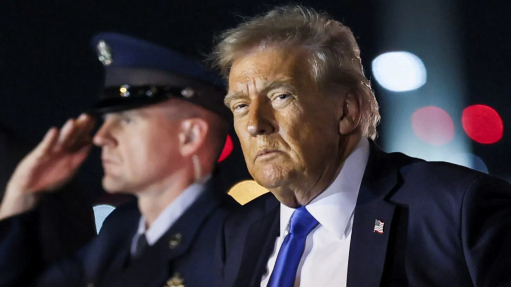 U.S. President Donald Trump looks on after disembarking from Air Force One at West Palm Beach, Florida.