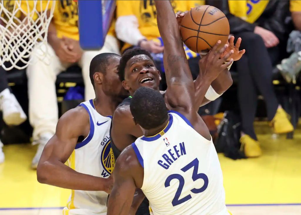 Minnesota Timberwolves' Anthony Edwards tries to score between Golden State Warriors' Draymond Green and Jonathan Kuminga in 2nd quarter during NBA Western Conference Semifinals' Game 3 at Chase Center in San Francisco on Saturday.