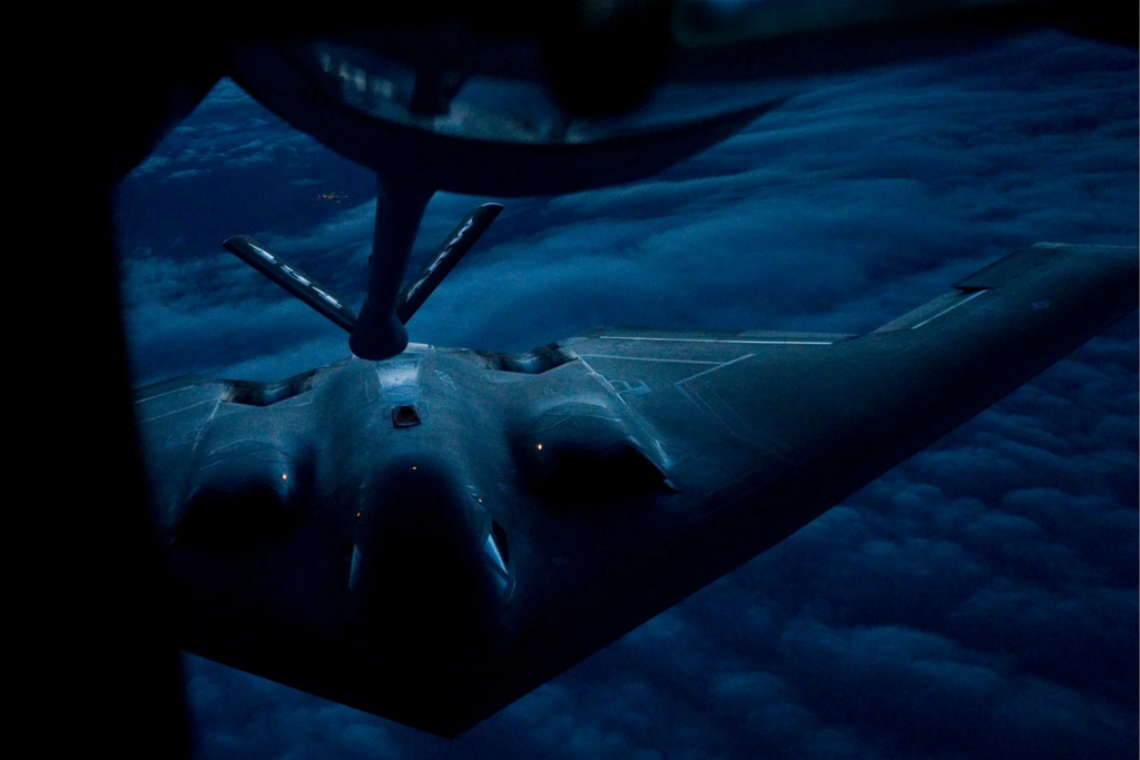 A B-2 Spirit from the 509th Bomb Wing, 13th Bomb Squadron Whiteman Air Force Base, Miss., prepares to be refueled by a KC-135R Stratotanker from the 434th Air Refueling Wing at Grissom Air Reserve Base, Ind., during a nighttime aerial refueling mission over Southern Kansas. US Air Force Photo