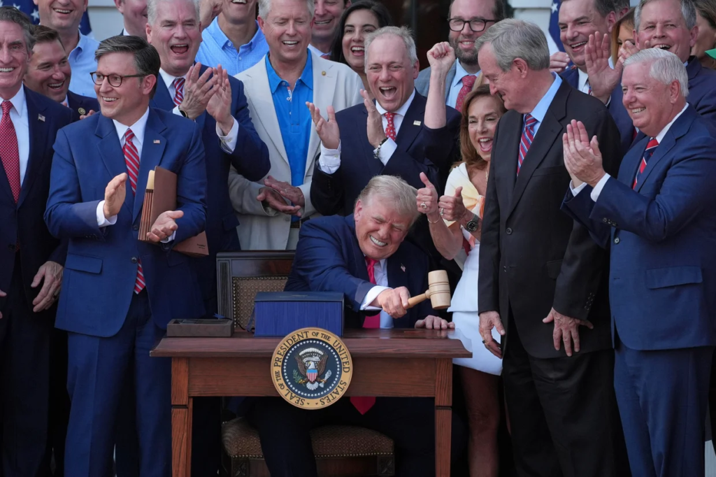 President Donald Trump bangs a gavel presented to him by House Speaker Mike Johnson of La., after he signed his signature bill of tax breaks and spending cuts at the White House, Friday, July 4, 2025, in Washington. Evan Vucci/AP