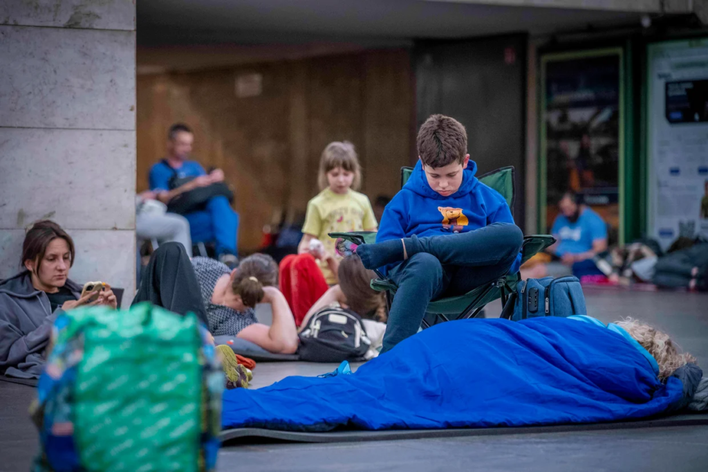 People hide in a metro station, being used as a bomb shelter, during a Russian drones attack in Kyiv, Ukraine, early hours Saturday, July 5, 2025. Dan Bashakov / AP