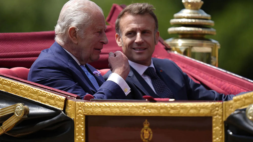 Britain’s King Charles III and France’s President Emmanuel Macron travel in the 1902 State Landau carriage during a carriage precession at Windsor Castle, in Windsor west of London, on July 8, 2025, on the first day of a three-day state visit to Britain. Andrew Matthews | Afp | Getty Images