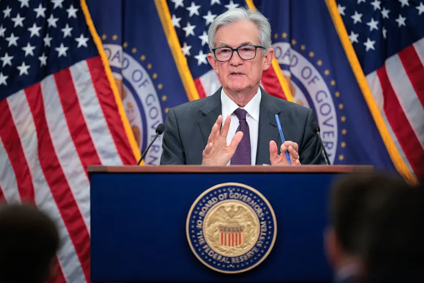 Fed approves quarter-point interest rate cut and sees two more coming this year