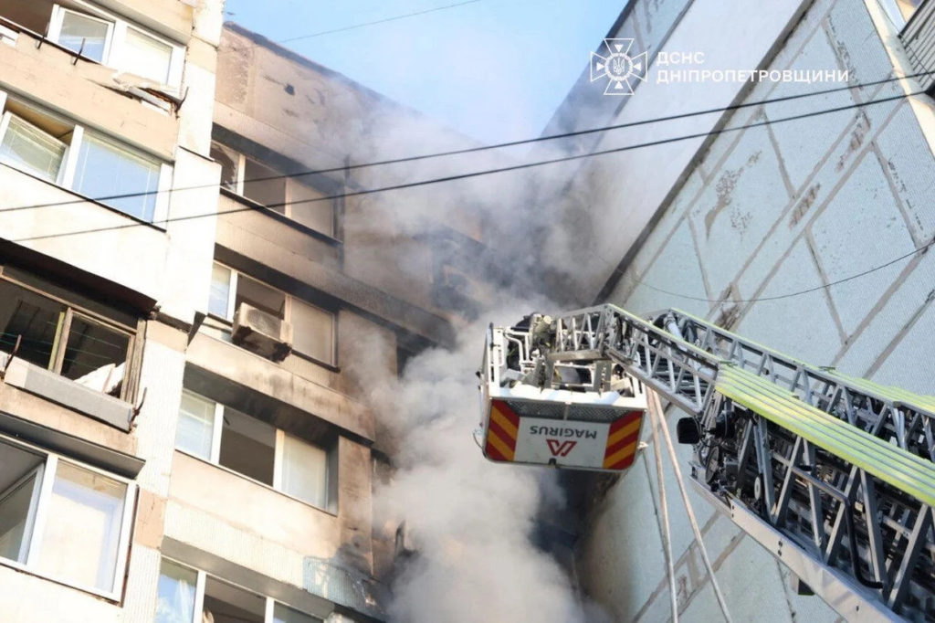 In this photo provided by the Ukrainian Emergency Services on Saturday, Sept. 20, 2025, a rescue worker puts out a fire of a residential house damaged by a Russian strike on Dnipro, Ukraine. Ukrainian Emergency Service via AP