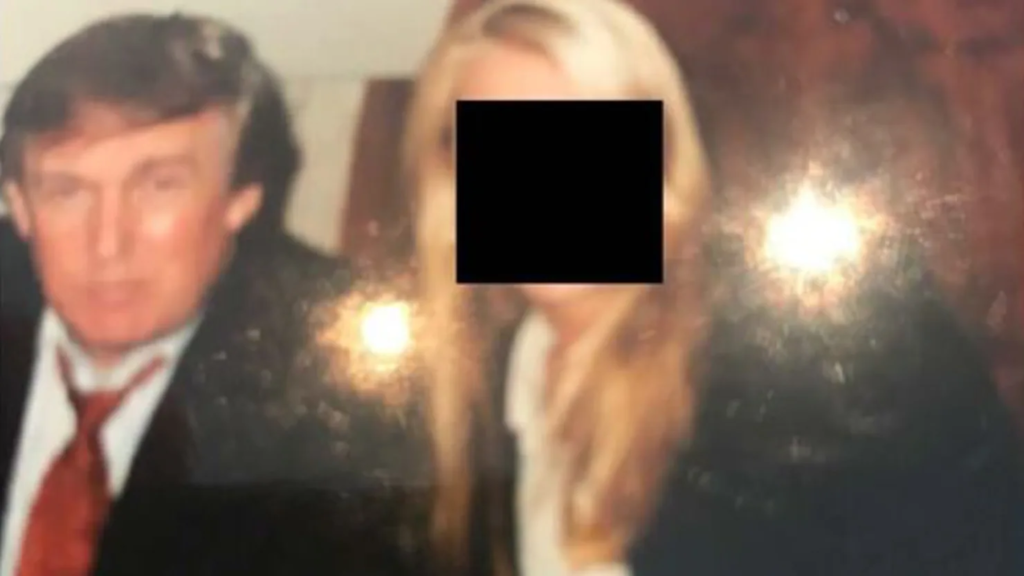 Photo from the Jeffrey Epstein files released by the Democrats on the House Oversight Committee shows Donald Trump with an unknown woman. Redaction from the Democrats on the House Oversight Committee. Date and Context is unclear.