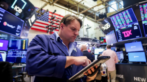 Stock futures are little changed as traders await inflation reading, monitor Iran war developments