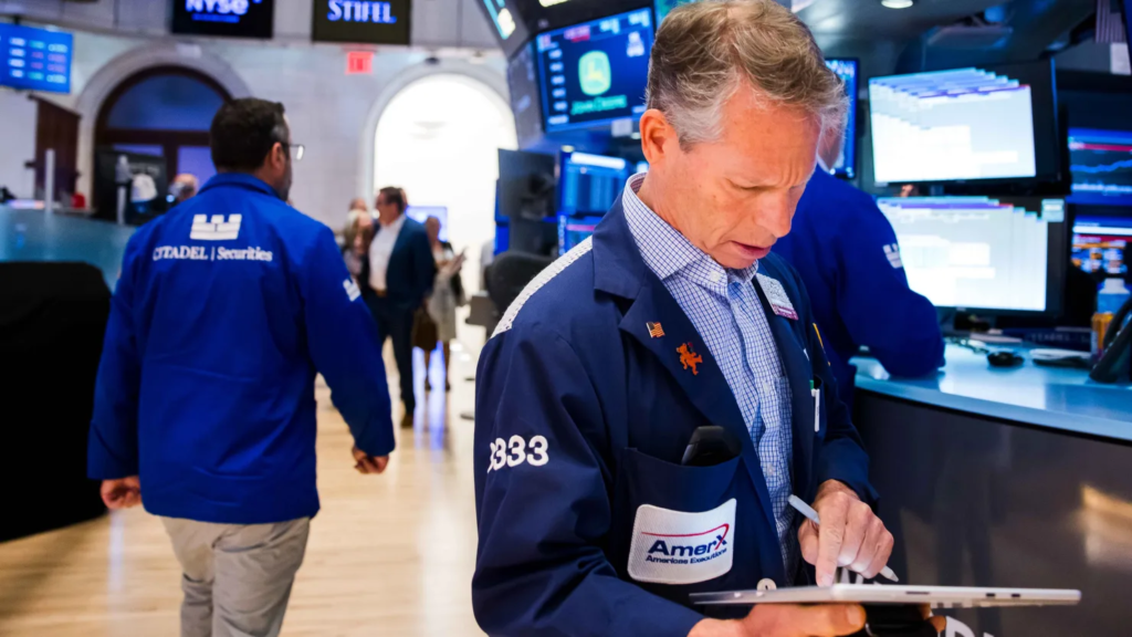 Dow surges nearly 900 points for record close as investors rotate away from tech names