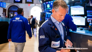 Dow surges nearly 900 points for record close as investors rotate away from tech names